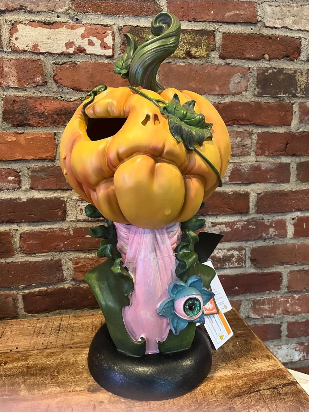 Whimsical Orange Pumpkin Figurine with Pink Accent
